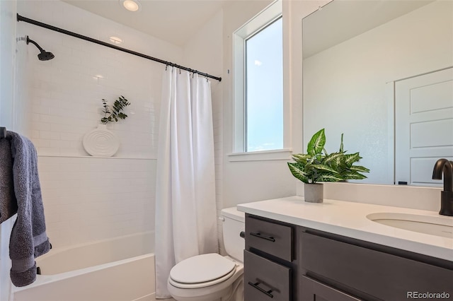 bathroom featuring toilet, vanity, and shower / bathtub combination with curtain