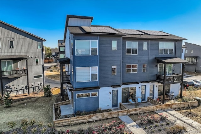 view of front of house with solar panels