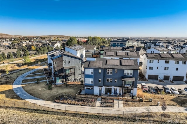 birds eye view of property with a residential view