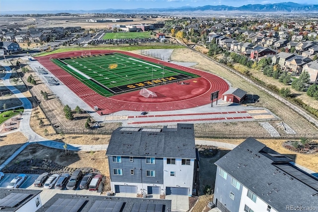 birds eye view of property with a mountain view and a residential view