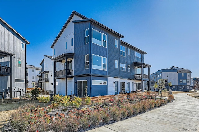 back of property featuring a residential view