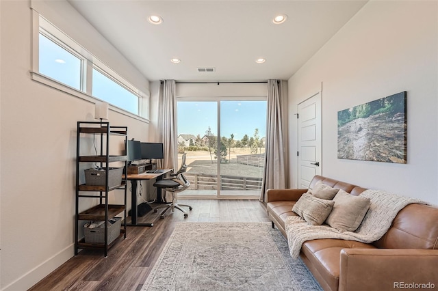 home office featuring dark wood finished floors, visible vents, recessed lighting, and baseboards