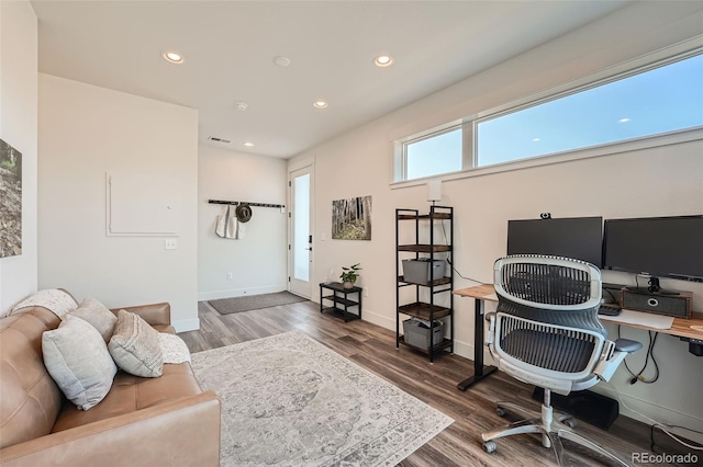 home office with visible vents, recessed lighting, wood finished floors, and baseboards