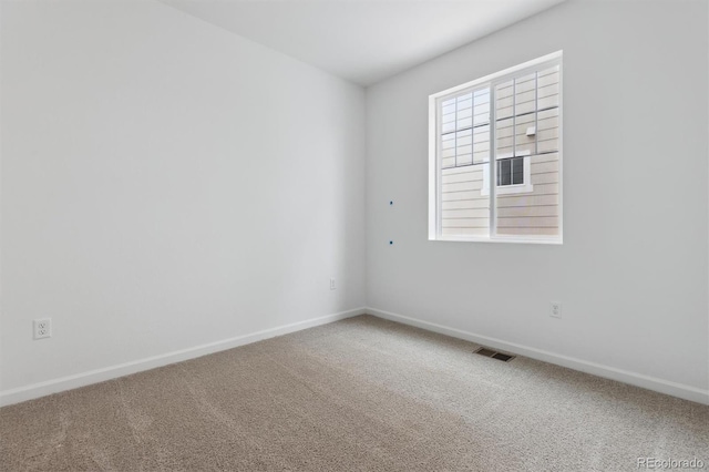 empty room with carpet flooring