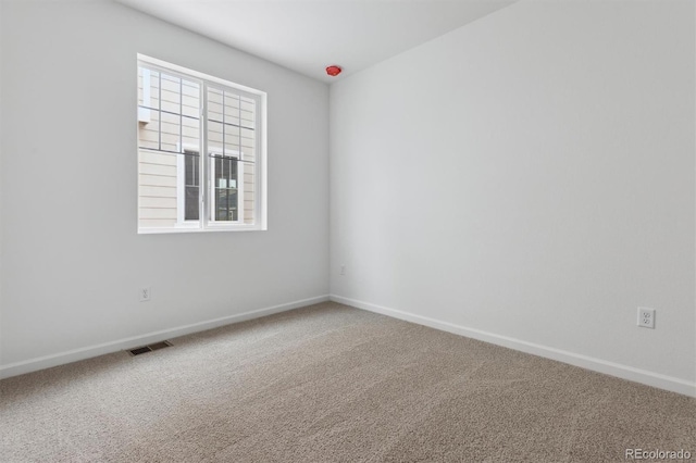 empty room featuring carpet floors