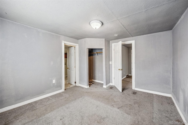 530 S Quitman St, Denver, CO 80219 - unfurnished bedroom with carpet, a closet, baseboards, and a textured ceiling