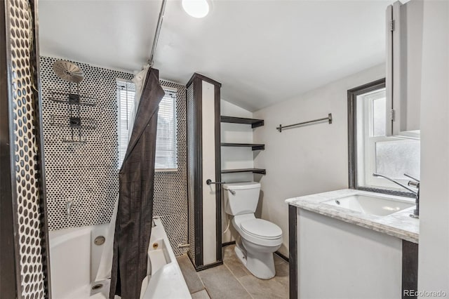 530 S Quitman St, Denver, CO 80219 - full bath with shower / tub combo with curtain, toilet, vanity, lofted ceiling, and tile patterned flooring