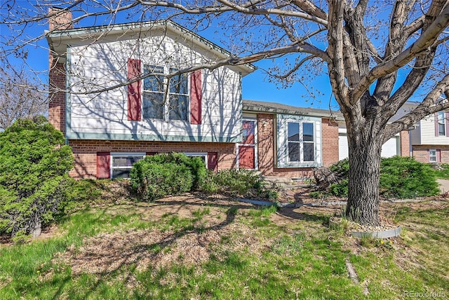 1796 S Yampa Way, Aurora, CO 80017 - split level home with brick siding and a chimney