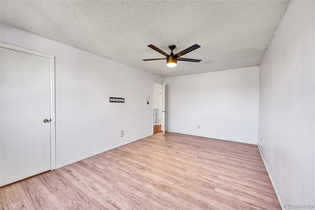 1796 S Yampa Way, Aurora, CO 80017 - unfurnished room featuring a ceiling fan, light wood-style flooring, a textured ceiling, and baseboards