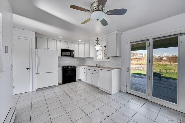 1796 S Yampa Way, Aurora, CO 80017 - kitchen featuring black appliances, backsplash, light countertops, light tile patterned floors, and a ceiling fan