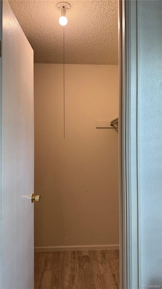 1796 S Yampa Way, Aurora, CO 80017 - walk in closet featuring wood finished floors