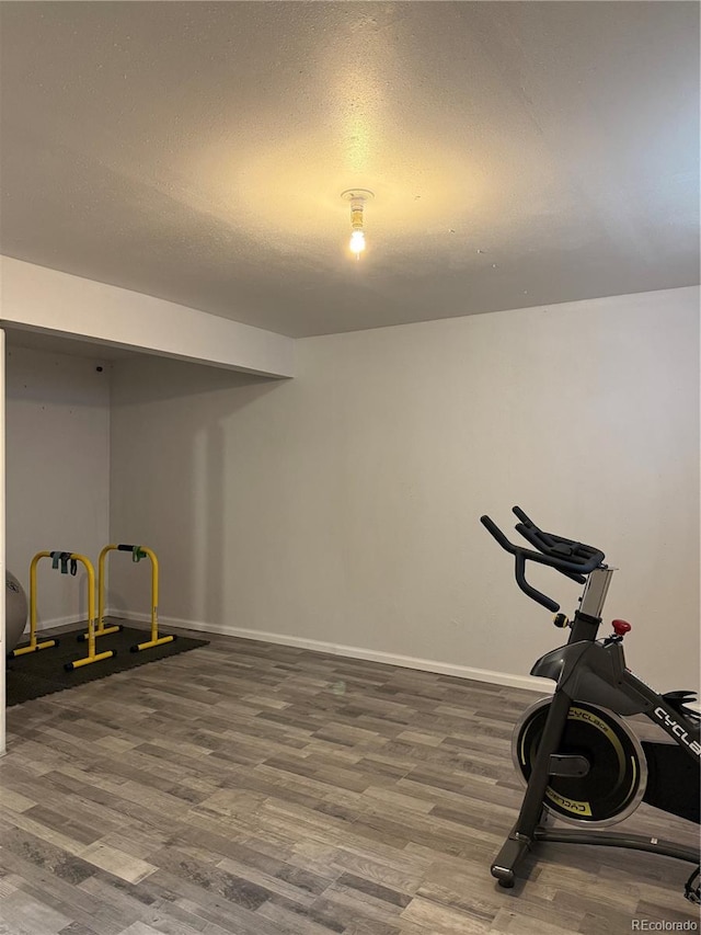 1796 S Yampa Way, Aurora, CO 80017 - exercise area featuring wood finished floors and a textured ceiling