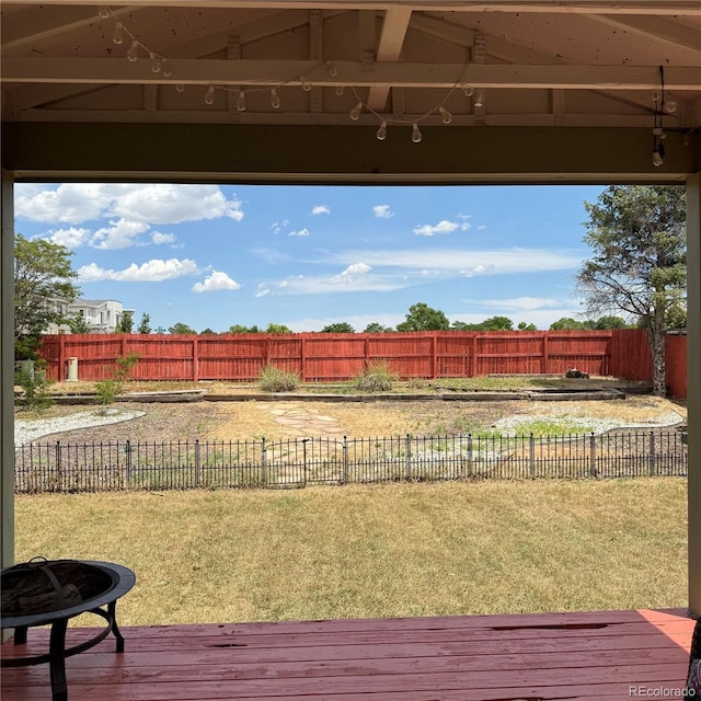 1796 S Yampa Way, Aurora, CO 80017 - fenced backyard with a deck and a fire pit