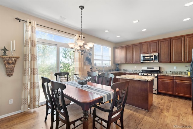 9290 Melborne Ct, Parker, CO 80134 - dining space featuring recessed lighting, light wood finished floors, a chandelier, and baseboards