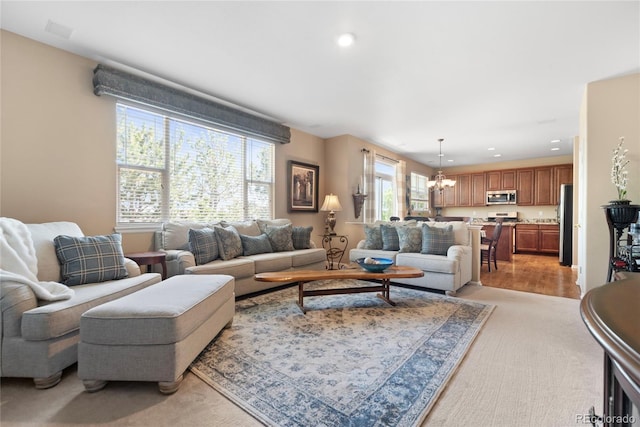 9290 Melborne Ct, Parker, CO 80134 - living area featuring recessed lighting, light colored carpet, and a chandelier