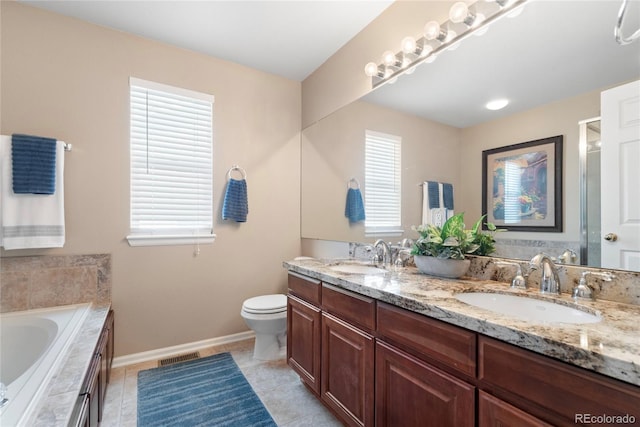9290 Melborne Ct, Parker, CO 80134 - bathroom featuring double vanity, a garden tub, baseboards, toilet, and tile patterned flooring