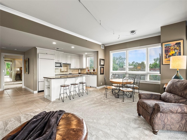 400 E 3rd Ave Unit 305, Denver, CO 80203 - living room with ornamental molding, baseboards, recessed lighting, and light tile patterned floors