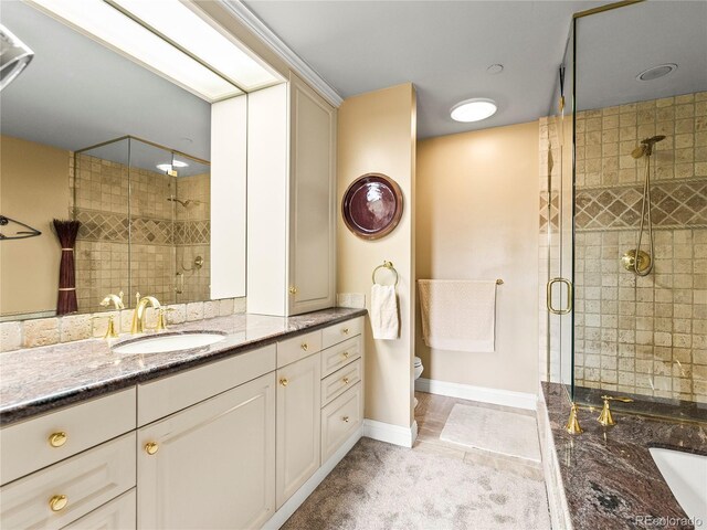 400 E 3rd Ave Unit 305, Denver, CO 80203 - full bath featuring a shower stall, vanity, toilet, tile patterned floors, and baseboards