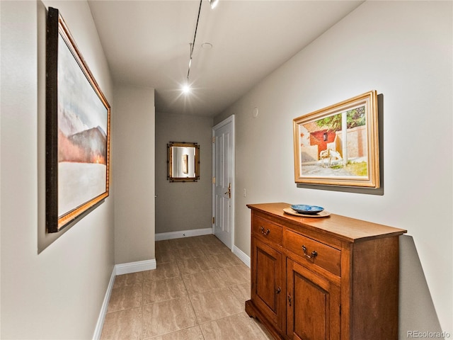 400 E 3rd Ave Unit 305, Denver, CO 80203 - hallway with rail lighting, baseboards, and light tile patterned floors