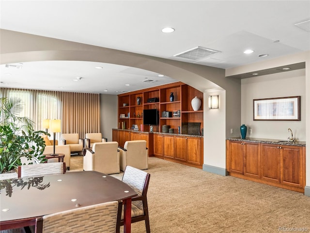 400 E 3rd Ave Unit 305, Denver, CO 80203 - dining area with light colored carpet, recessed lighting, and arched walkways