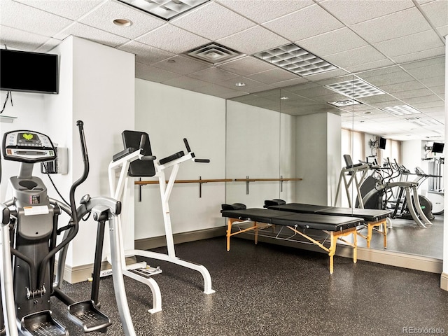 400 E 3rd Ave Unit 305, Denver, CO 80203 - workout area featuring a drop ceiling and baseboards