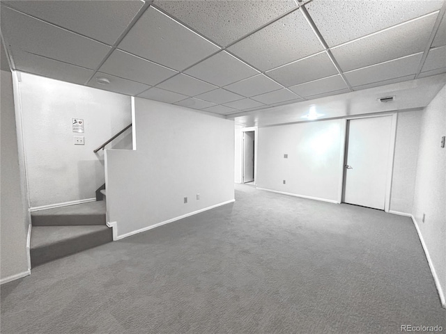 4493 Dunkirk Way, Denver, CO 80249 - finished below grade area with a paneled ceiling, baseboards, stairs, and carpet