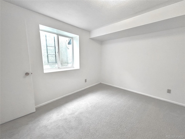 4493 Dunkirk Way, Denver, CO 80249 - unfurnished room featuring carpet, baseboards, and a textured ceiling