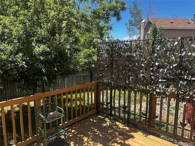 4493 Dunkirk Way, Denver, CO 80249 - wooden terrace featuring a fenced backyard
