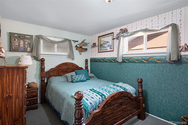 carpeted bedroom featuring multiple windows