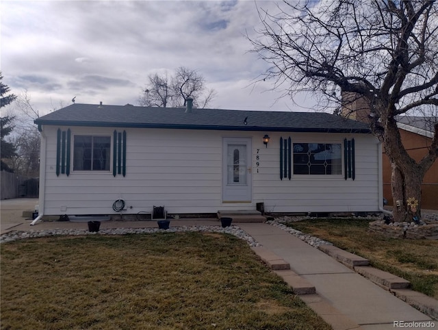 7891 Poplar St, Commerce City, CO 80022 - single story home with entry steps, a front lawn, and roof with shingles