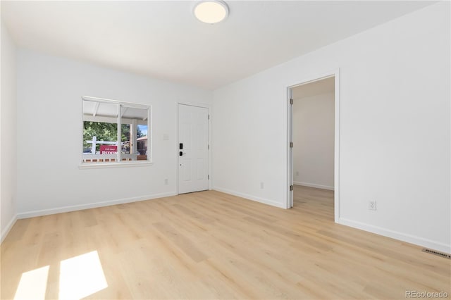 empty room with light wood-type flooring