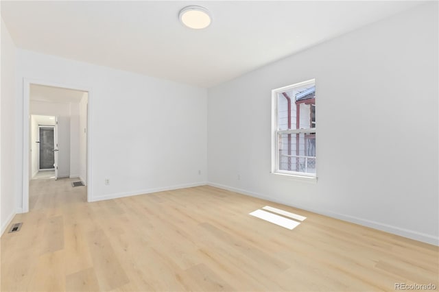 unfurnished room featuring light hardwood / wood-style floors