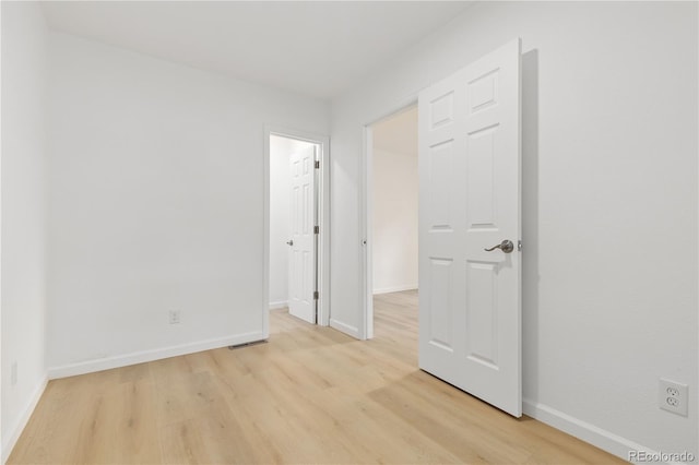 unfurnished bedroom with light hardwood / wood-style floors