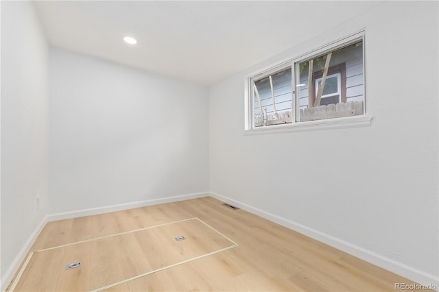 empty room with light wood-type flooring