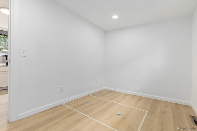 spare room with light wood-type flooring