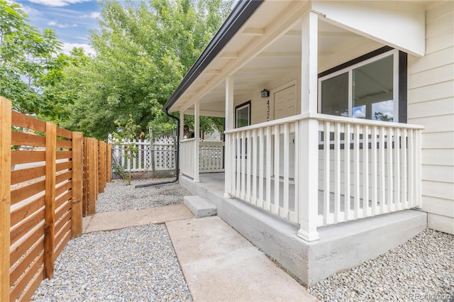 view of property exterior featuring covered porch