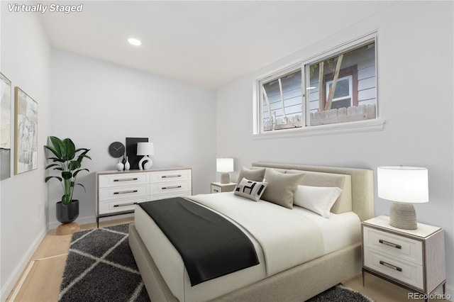 bedroom featuring light hardwood / wood-style floors