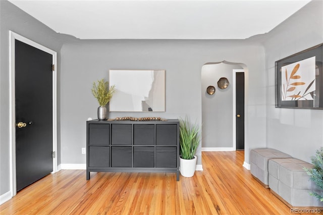 interior space featuring baseboards and wood finished floors