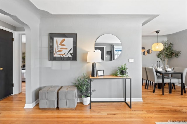 interior space featuring wood finished floors and baseboards