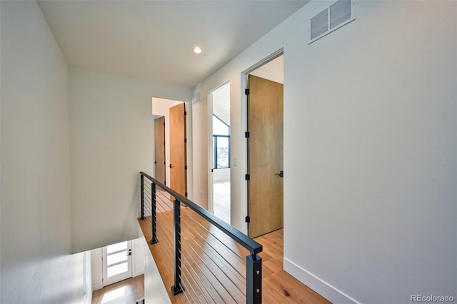 hall with light hardwood / wood-style floors