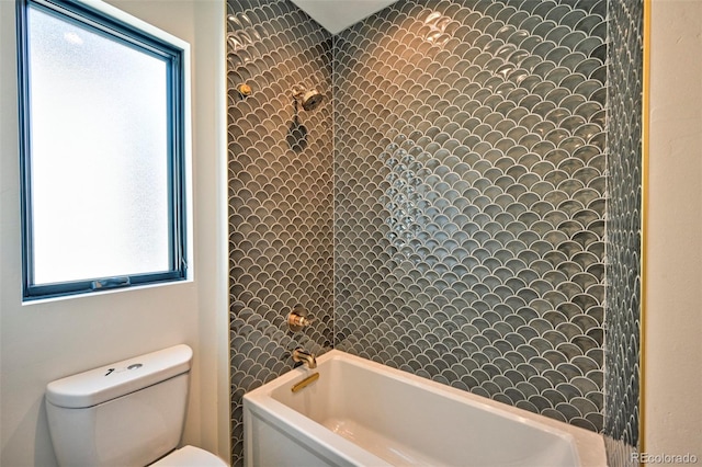 bathroom with shower / bathtub combination and toilet