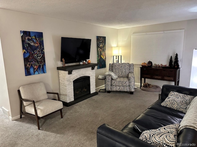 living room with a textured ceiling, carpet floors, and a stone fireplace