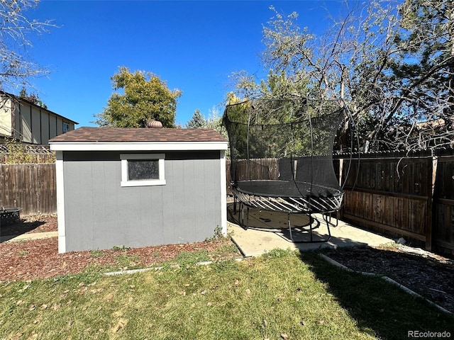 exterior space with a shed and a trampoline