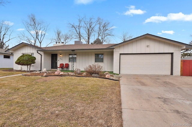 ranch-style house with brick siding, a chimney, concrete driveway, an attached garage, and a front lawn