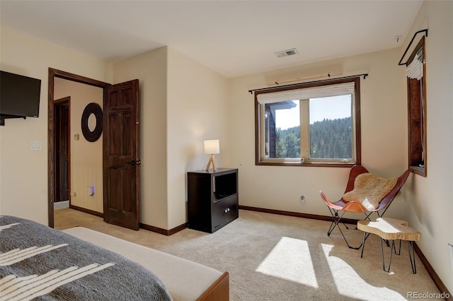 bedroom featuring light carpet