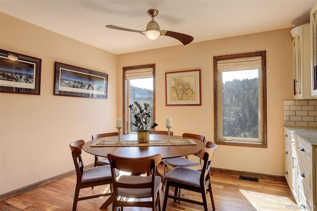 dining area featuring light hardwood / wood-style flooring, plenty of natural light, and ceiling fan