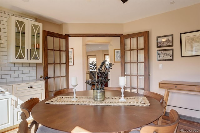 dining room featuring french doors and hardwood / wood-style flooring