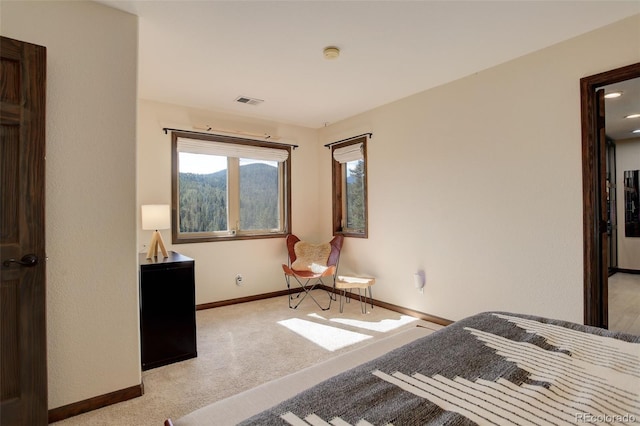 unfurnished bedroom featuring light carpet