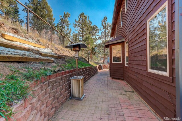 view of side of property featuring a patio