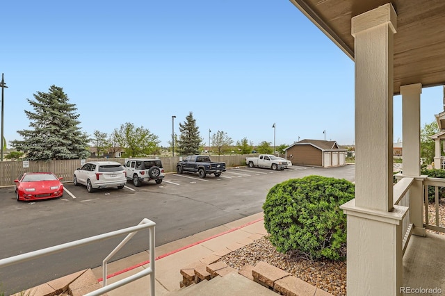 14700 E 104th Ave Unit 2802, Commerce City, CO 80022 - uncovered parking lot featuring fence